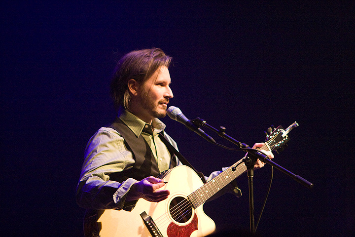 Max Avery Lichtenstein on stage with guitar